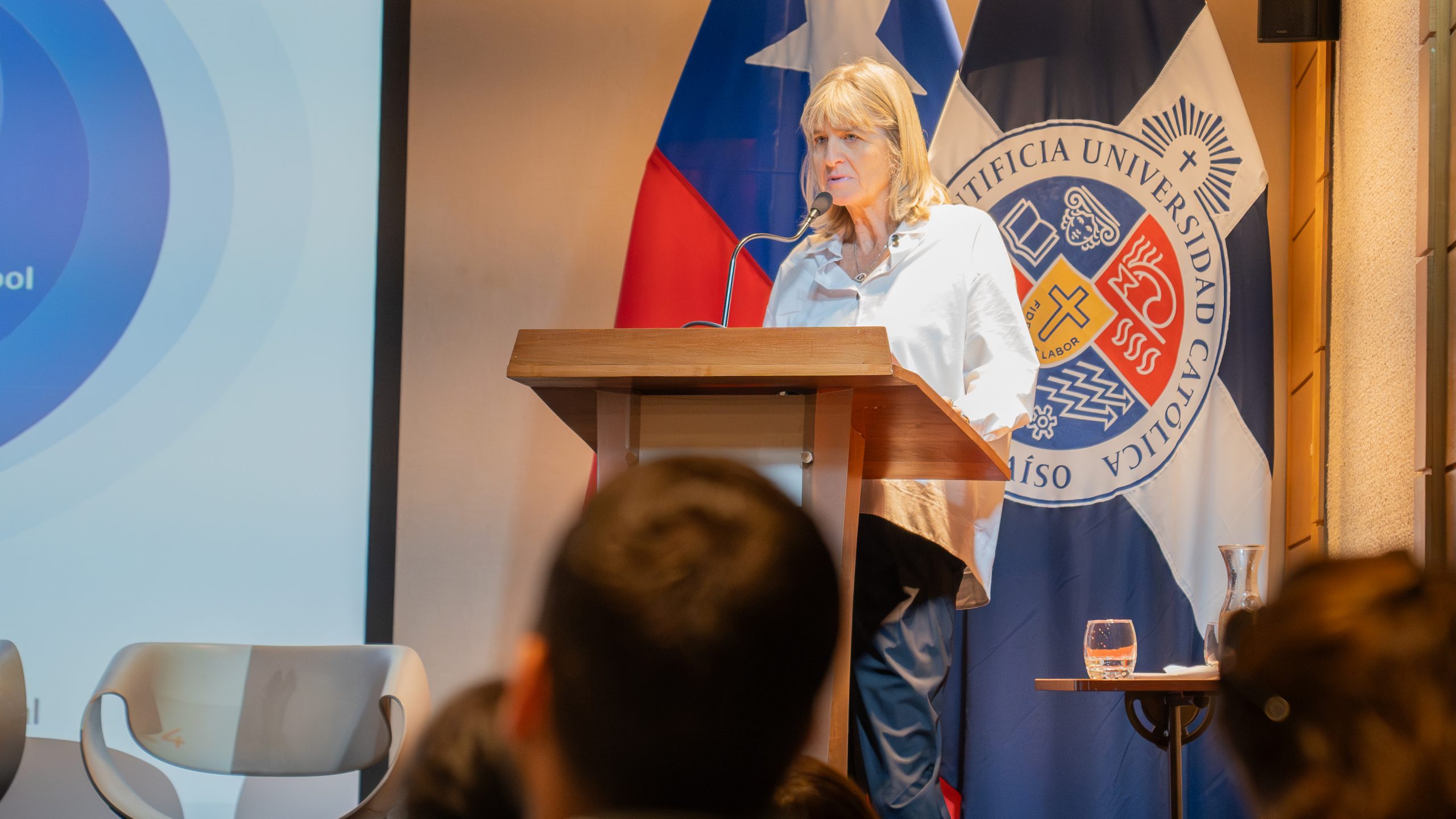 A presenter delivering their talk behind a podium at LfPL 2024.