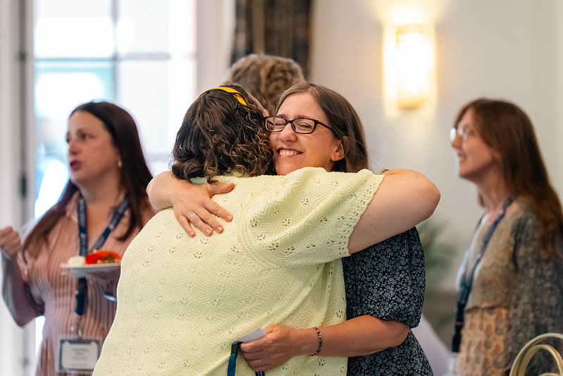 Two women hugging and smiling at LfPL 2026