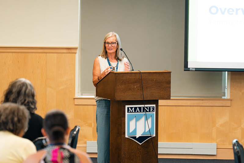 Woman speaking at symposium podium